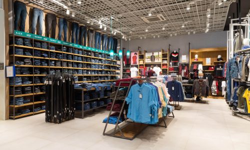 interior-shot-racks-with-shirts-undershirts-jeans-min
