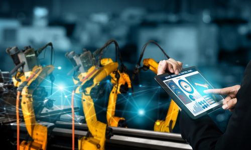 Smart industry robot arms for digital factory production technology showing automation manufacturing process of the Industry 4.0 or 4th industrial revolution and IOT software to control operation .